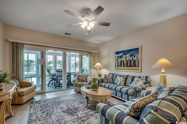 601 Hillside Dr N Unit 3704, North Myrtle Beach, SC 29582 - living area featuring healthy amount of natural light, wood finished floors, and a ceiling fan
