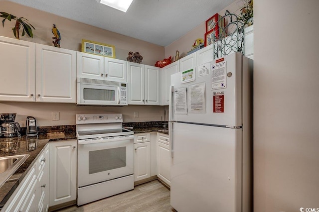 601 Hillside Dr N Unit 3704, North Myrtle Beach, SC 29582 - kitchen featuring white appliances, white cabinetry, light wood-type flooring, and a sink