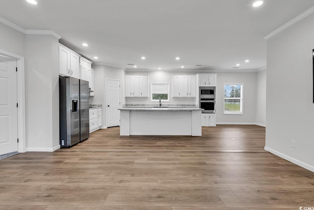 1529 Bucksport Rd, Conway, SC 29527 - kitchen featuring stainless steel appliances, a sink, crown molding, white cabinets, and baseboards