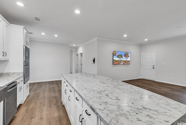 1529 Bucksport Rd, Conway, SC 29527 - kitchen with appliances with stainless steel finishes, dark wood-type flooring, recessed lighting, ornamental molding, and white cabinetry