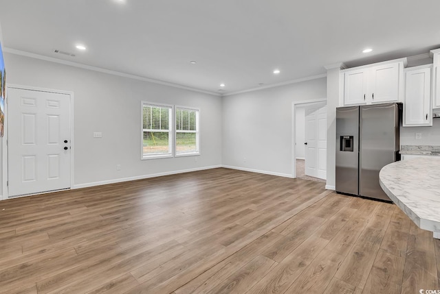 1529 Bucksport Rd, Conway, SC 29527 - unfurnished living room with crown molding, light wood-style flooring, baseboards, and recessed lighting