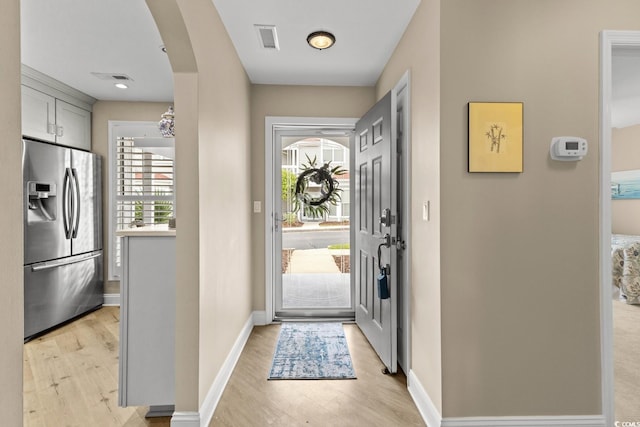 4396 Baldwin Ave Unit 30, Little River, SC 29566 - foyer featuring light wood finished floors, arched walkways, and baseboards