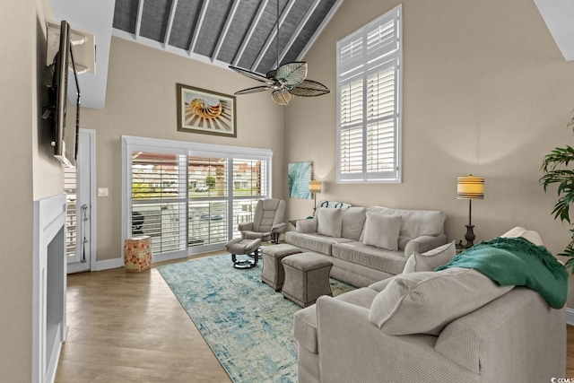 4396 Baldwin Ave Unit 30, Little River, SC 29566 - living area featuring plenty of natural light, wood finished floors, high vaulted ceiling, baseboards, and a ceiling fan