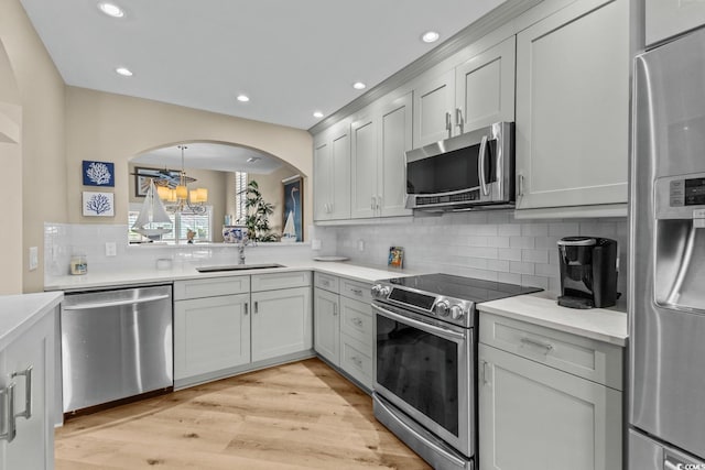 4396 Baldwin Ave Unit 30, Little River, SC 29566 - kitchen featuring appliances with stainless steel finishes, a sink, recessed lighting, tasteful backsplash, and light countertops