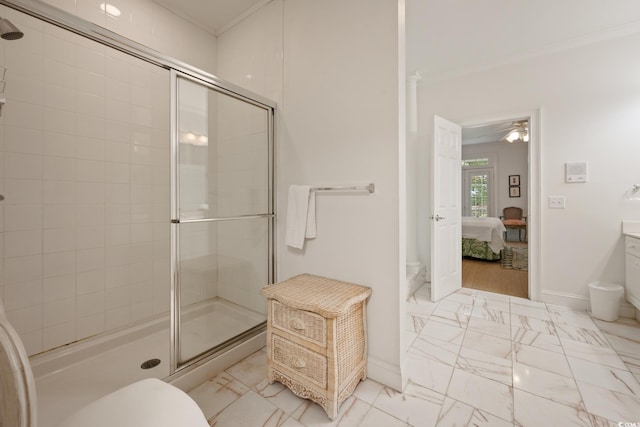 214 Sea Island Dr, Georgetown, SC 29440 - ensuite bathroom with a stall shower, marble finish flooring, ornamental molding, toilet, and baseboards
