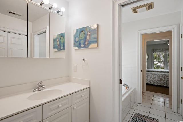 214 Sea Island Dr, Georgetown, SC 29440 - bathroom with vanity, a tub, tile patterned floors, and connected bathroom