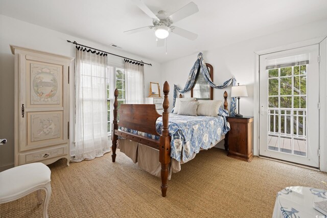 214 Sea Island Dr, Georgetown, SC 29440 - bedroom with multiple windows, access to outside, light carpet, and ceiling fan