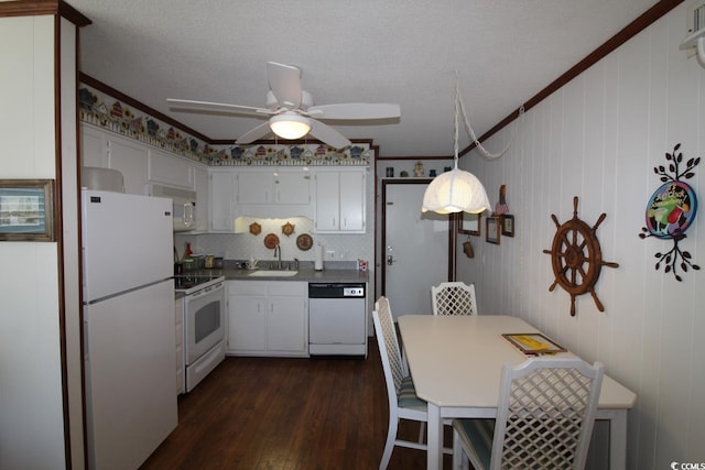 1582 S Waccamaw Dr Unit 56, Garden City Beach, SC 29576 - kitchen with white appliances, crown molding, dark wood finished floors, a ceiling fan, and white cabinets