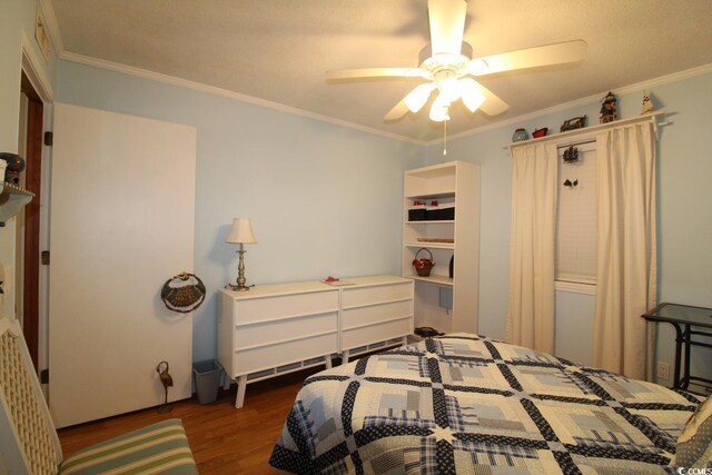 1582 S Waccamaw Dr Unit 56, Garden City Beach, SC 29576 - bedroom with wood finished floors, ornamental molding, and ceiling fan