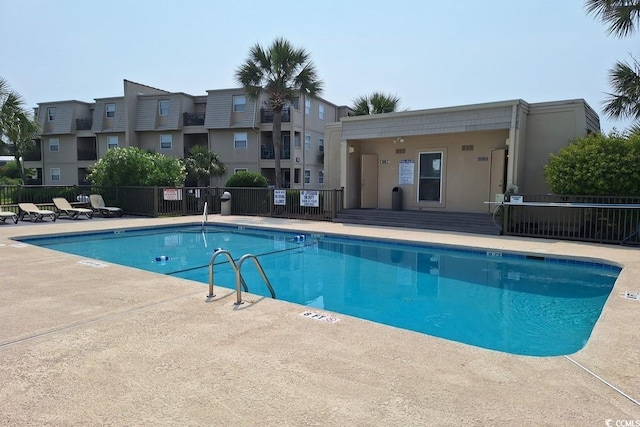 1582 S Waccamaw Dr Unit 56, Garden City Beach, SC 29576 - community pool featuring a patio