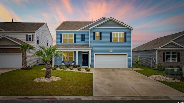 3573 Bells Lake Cir, Longs, SC 29568 - view of front facade with a garage, concrete driveway, a front yard, covered porch, and roof with shingles