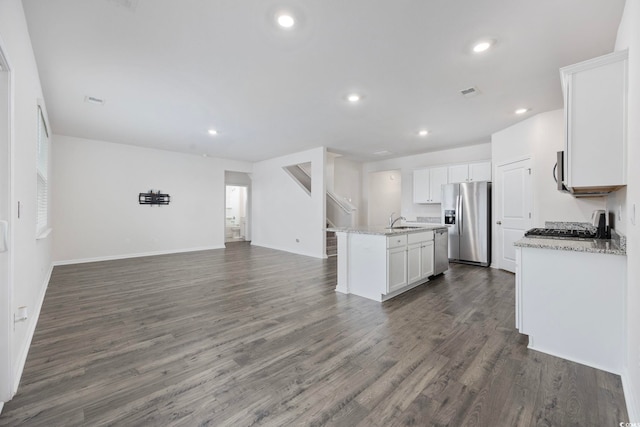 3573 Bells Lake Cir, Longs, SC 29568 - kitchen with appliances with stainless steel finishes, open floor plan, a center island with sink, white cabinets, and a sink