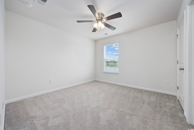 3573 Bells Lake Cir, Longs, SC 29568 - spare room featuring carpet, baseboards, a ceiling fan, and a smoke detector
