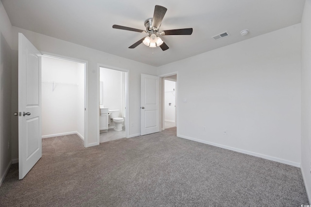 3573 Bells Lake Cir, Longs, SC 29568 - unfurnished bedroom with a spacious closet, carpet, baseboards, a closet, and ensuite bath