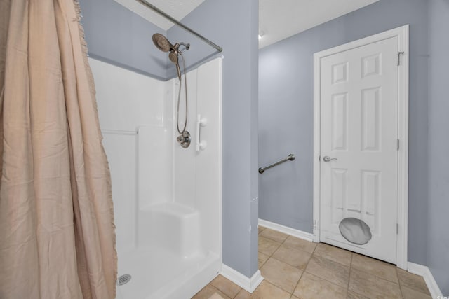 137 Maiden Ln, Myrtle Beach, SC 29588 - bathroom with a shower with shower curtain, baseboards, and tile patterned floors