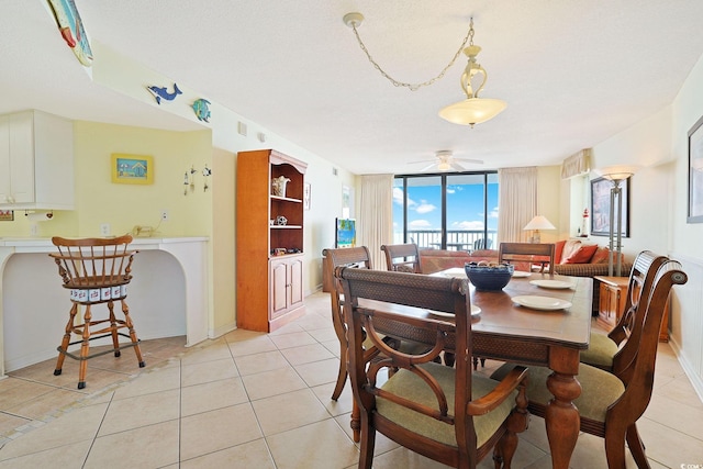 201 S Ocean Blvd Unit 1106, North Myrtle Beach, SC 29582 - dining room with light tile patterned flooring and a ceiling fan