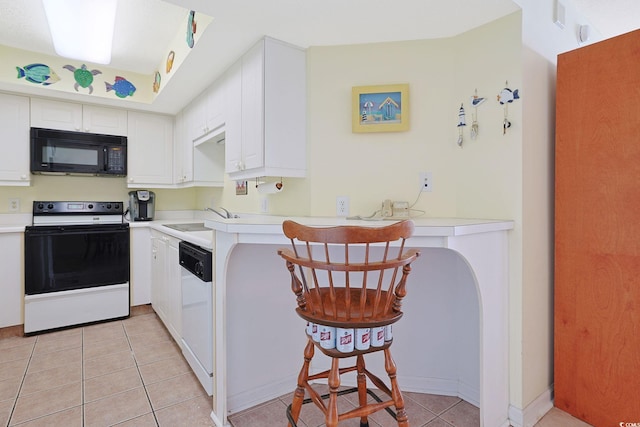 201 S Ocean Blvd Unit 1106, North Myrtle Beach, SC 29582 - kitchen with white appliances, light tile patterned flooring, light countertops, and white cabinets