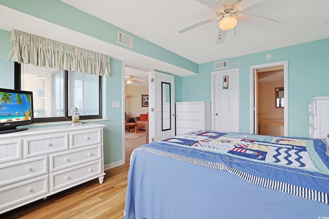 201 S Ocean Blvd Unit 1106, North Myrtle Beach, SC 29582 - bedroom with light wood finished floors, connected bathroom, and a ceiling fan