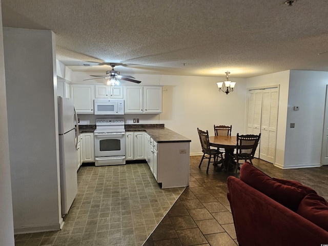 197 Charter Dr Unit D1, Longs, SC 29568 - kitchen with white appliances, dark countertops, a chandelier, a peninsula, and white cabinetry