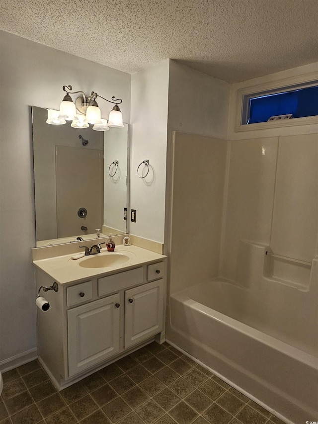 197 Charter Dr Unit D1, Longs, SC 29568 - bathroom featuring a textured ceiling, vanity, tile patterned floors, and bathing tub / shower combination