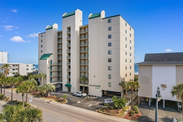 4505 S Ocean Blvd Unit 5D, North Myrtle Beach, SC 29582 - view of apartment building / complex with uncovered parking