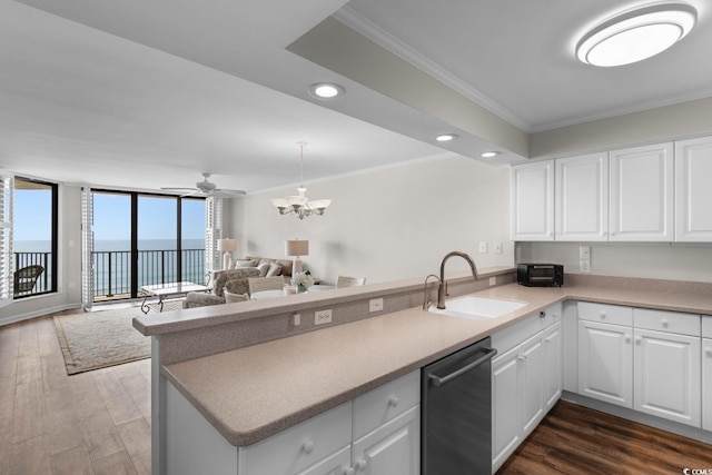 4505 S Ocean Blvd Unit 5D, North Myrtle Beach, SC 29582 - kitchen featuring a sink, a peninsula, stainless steel dishwasher, ornamental molding, and recessed lighting