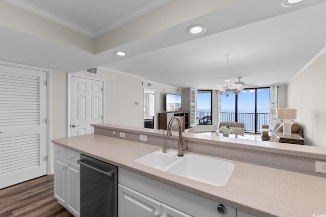 4505 S Ocean Blvd Unit 5D, North Myrtle Beach, SC 29582 - kitchen featuring a sink, stainless steel dishwasher, ornamental molding, open floor plan, and light countertops