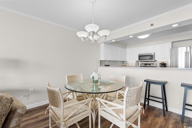 4505 S Ocean Blvd Unit 5D, North Myrtle Beach, SC 29582 - dining room with a chandelier, ornamental molding, dark wood-style flooring, baseboards, and recessed lighting