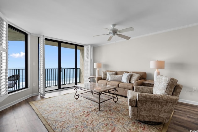 4505 S Ocean Blvd Unit 5D, North Myrtle Beach, SC 29582 - living room featuring wood finished floors, ceiling fan, ornamental molding, and baseboards