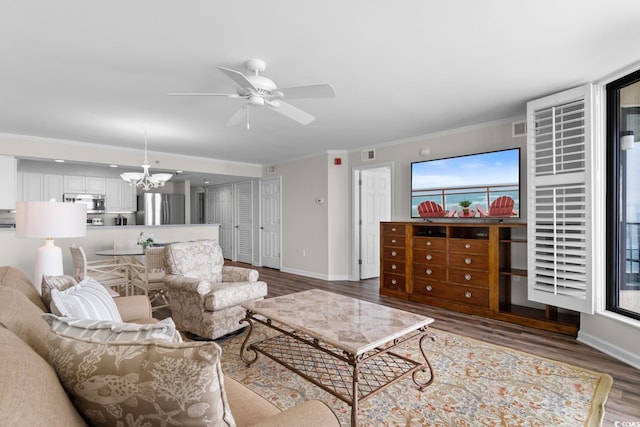 4505 S Ocean Blvd Unit 5D, North Myrtle Beach, SC 29582 - living room featuring wood finished floors, a chandelier, ceiling fan, crown molding, and baseboards