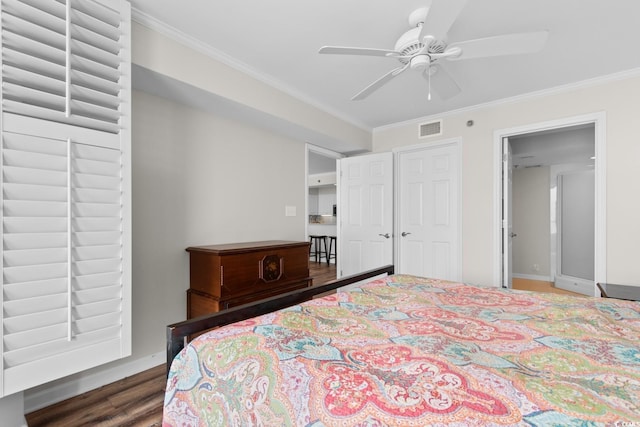 4505 S Ocean Blvd Unit 5D, North Myrtle Beach, SC 29582 - bedroom with ornamental molding, wood finished floors, a ceiling fan, and baseboards