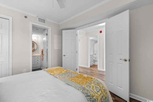 4505 S Ocean Blvd Unit 5D, North Myrtle Beach, SC 29582 - bedroom with wood finished floors, ornamental molding, ensuite bathroom, baseboards, and ceiling fan