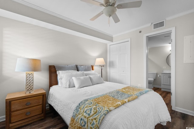 4505 S Ocean Blvd Unit 5D, North Myrtle Beach, SC 29582 - bedroom with crown molding, dark wood-style flooring, a closet, baseboards, and ensuite bathroom
