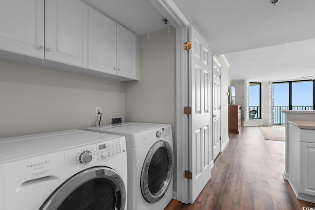4505 S Ocean Blvd Unit 5D, North Myrtle Beach, SC 29582 - laundry room with washer and clothes dryer and dark wood-style flooring