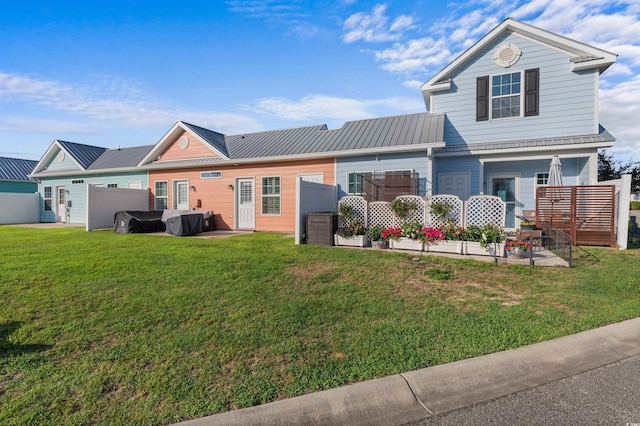 603 Wave Rider Ln Unit 603, North Myrtle Beach, SC 29582 - view of front of home with a patio and metal roof
