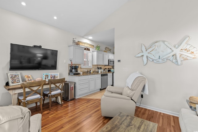 603 Wave Rider Ln Unit 603, North Myrtle Beach, SC 29582 - living area featuring lofted ceiling, light wood-style flooring, recessed lighting, and baseboards
