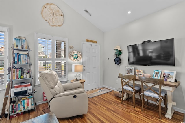603 Wave Rider Ln Unit 603, North Myrtle Beach, SC 29582 - living area featuring high vaulted ceiling, wood finished floors, and baseboards