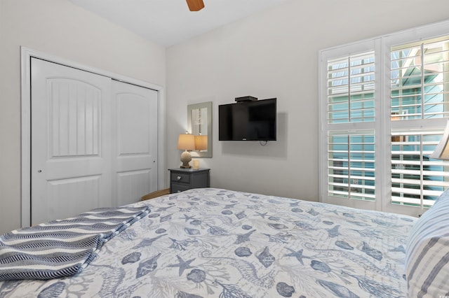 603 Wave Rider Ln Unit 603, North Myrtle Beach, SC 29582 - bedroom with multiple windows, a closet, and a ceiling fan