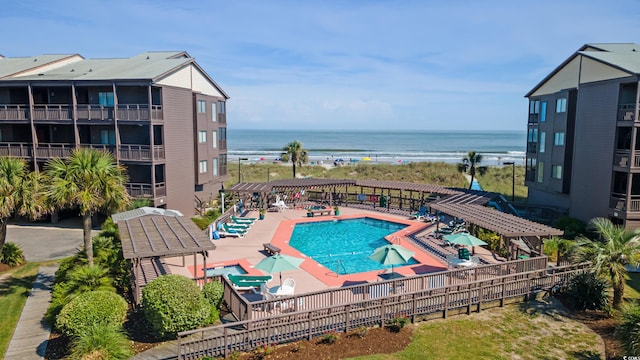 202 N Ocean Blvd Unit 109, North Myrtle Beach, SC 29582 - community pool with a water view, a pergola, and a patio area