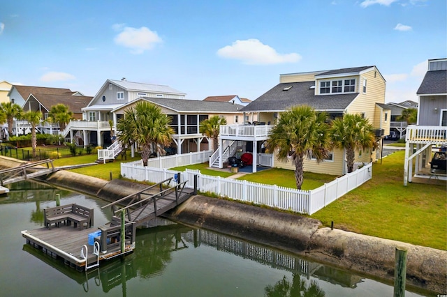 39 Newport St, Ocean Isle Beach, NC 28469 - rear view of property with stairway, a deck with water view, a residential view, and a shingled roof
