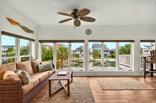 39 Newport St, Ocean Isle Beach, NC 28469 - sunroom / solarium with healthy amount of natural light, ornamental molding, a water view, wood finished floors, and a residential view
