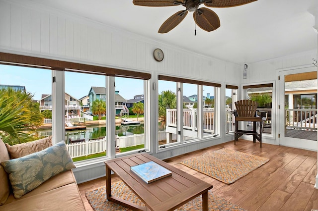 39 Newport St, Ocean Isle Beach, NC 28469 - sunroom featuring ceiling fan, healthy amount of natural light, hardwood / wood-style floors, and ornamental molding