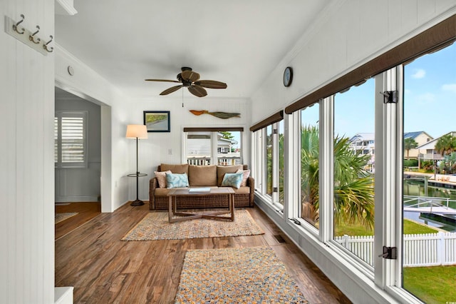 39 Newport St, Ocean Isle Beach, NC 28469 - sunroom / solarium with plenty of natural light, wood-type flooring, and crown molding