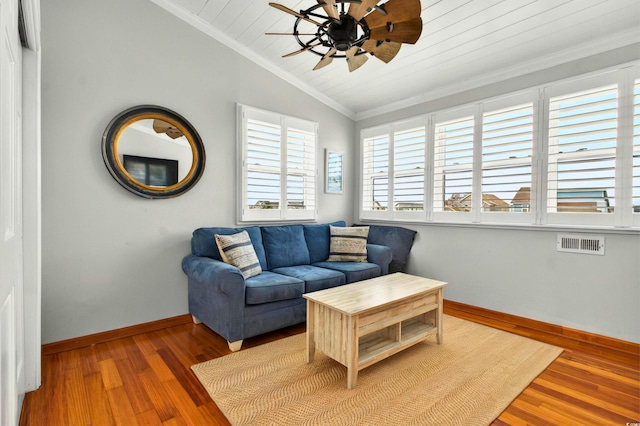 39 Newport St, Ocean Isle Beach, NC 28469 - living area featuring vaulted ceiling, baseboards, ornamental molding, wood finished floors, and a ceiling fan