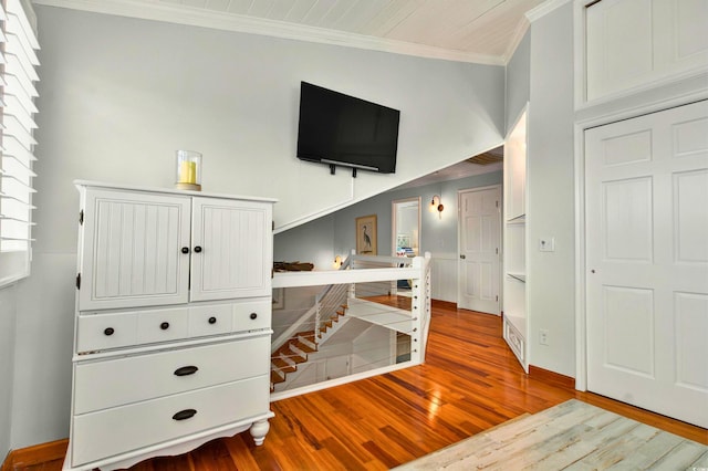 39 Newport St, Ocean Isle Beach, NC 28469 - bedroom featuring crown molding, wood finished floors, and baseboards