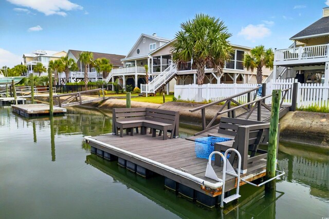 39 Newport St, Ocean Isle Beach, NC 28469 - dock area featuring stairs and a water view