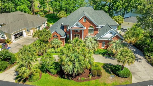 1119 Links Rd, Myrtle Beach, SC 29575 - view of front of house with driveway, brick siding, and a garage