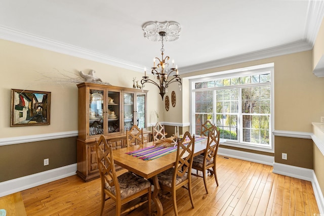 1119 Links Rd, Myrtle Beach, SC 29575 - dining area featuring a chandelier, baseboards, light wood finished floors, and ornamental molding