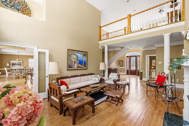 1119 Links Rd, Myrtle Beach, SC 29575 - living area with ornate columns, a high ceiling, hardwood / wood-style flooring, ornamental molding, and baseboards