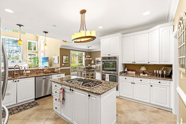 1119 Links Rd, Myrtle Beach, SC 29575 - kitchen featuring stainless steel appliances, dark stone counters, a kitchen island, white cabinets, and recessed lighting